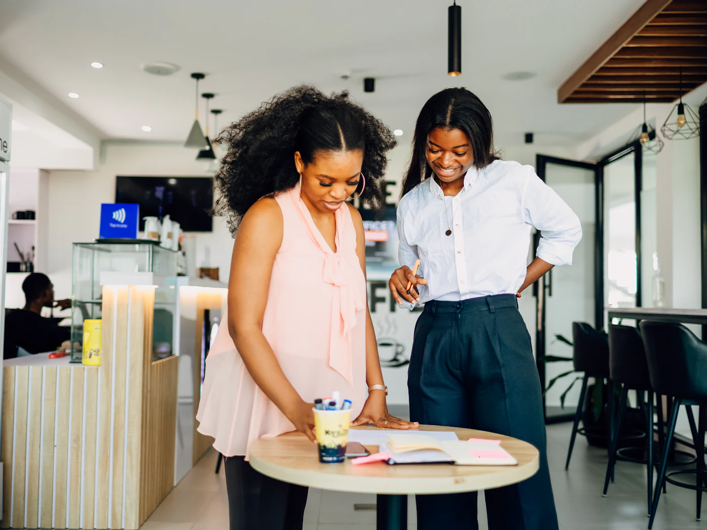 Two women reviewing a business plan together